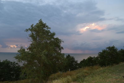 Scenic view of sea against cloudy sky