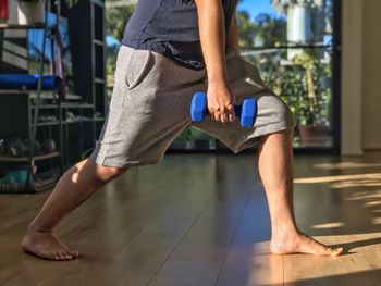 Low section of man standing on floor