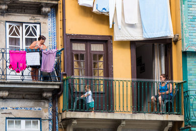 People standing in balcony of building