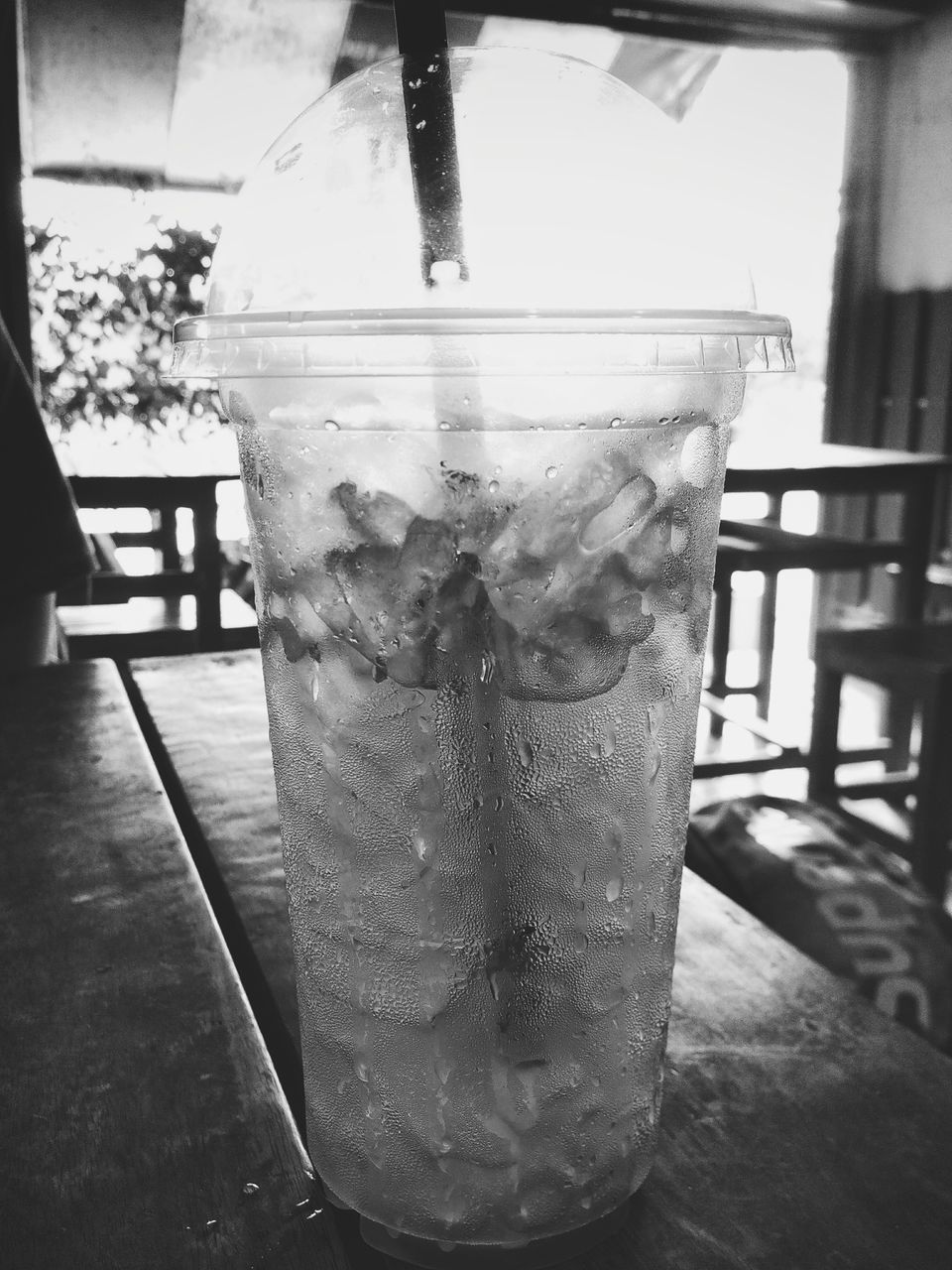 indoors, table, close-up, sunlight, still life, shadow, empty, glass - material, wood - material, no people, day, chair, built structure, absence, drink, window, home interior, drinking glass, focus on foreground, food and drink