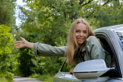 Portrait of young woman using mobile phone