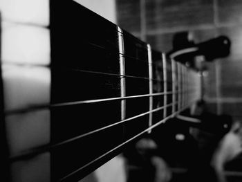 Close-up of guitar playing piano