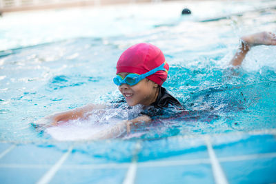 Girl swimming in pool