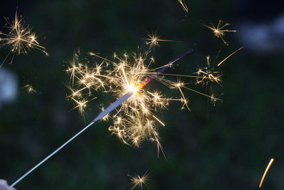 Midsection of a sparkler at night