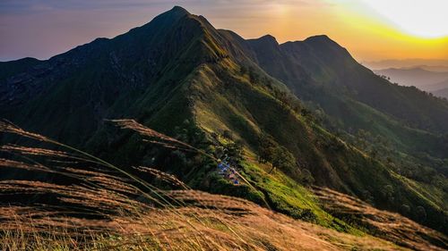 Scenic view of mountains against sky during sunset