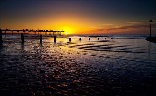 Scenic view of sea against sky at sunset
