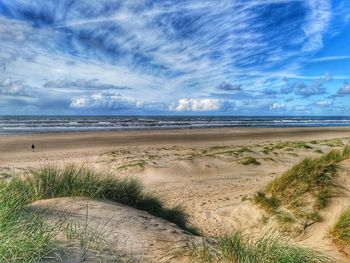 Scenic view of beach against sky