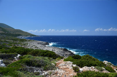 Scenic view of sea against clear blue sky