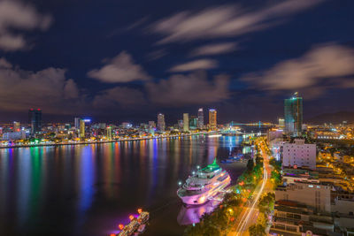 High angle view of illuminated city buildings at night