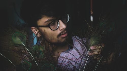 Close-up portrait of young man with eyeglasses