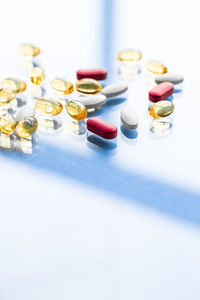 Close-up of pills on white background