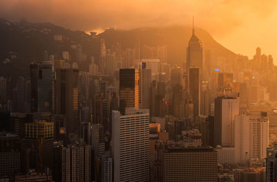 High angle view of city buildings during sunset