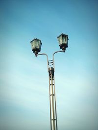 Low angle view of floodlight against clear blue sky