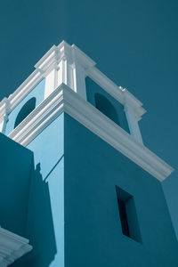 Low angle view of building against blue sky