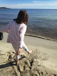 Rear view of woman on beach