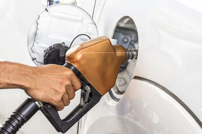 Close-up of man working in car