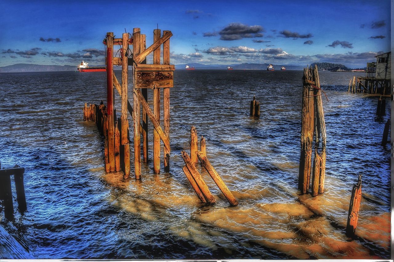 water, sea, sky, cloud - sky, wood - material, post, nature, tranquility, no people, wooden post, tranquil scene, scenics - nature, beauty in nature, horizon over water, land, horizon, beach, architecture, built structure, outdoors