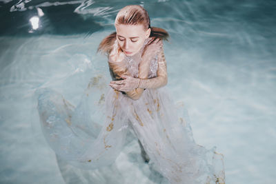 High angle view of woman in water