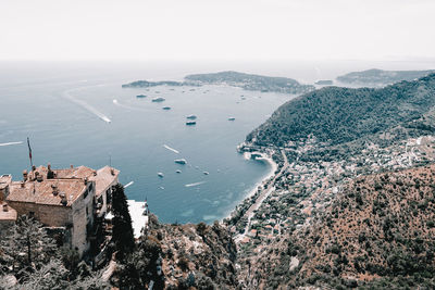 High angle view of sea and mountains against sky