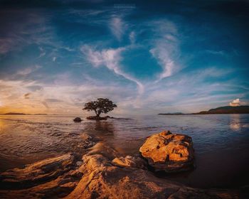 Scenic view of lake against sky during sunset