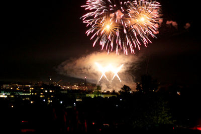 Firework display at night