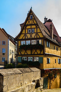 Exterior of old building in town against sky