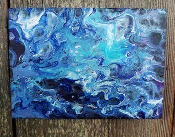 Full frame shot of multi colored water on wood