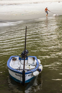 Man rowing boat in sea