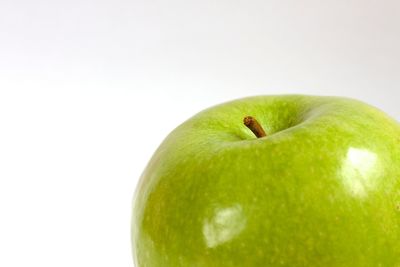 Close-up of fruit over white background