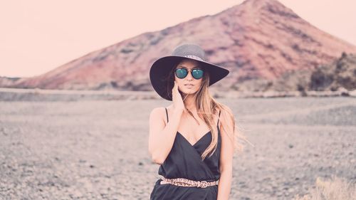 Portrait of young woman wearing sunglasses