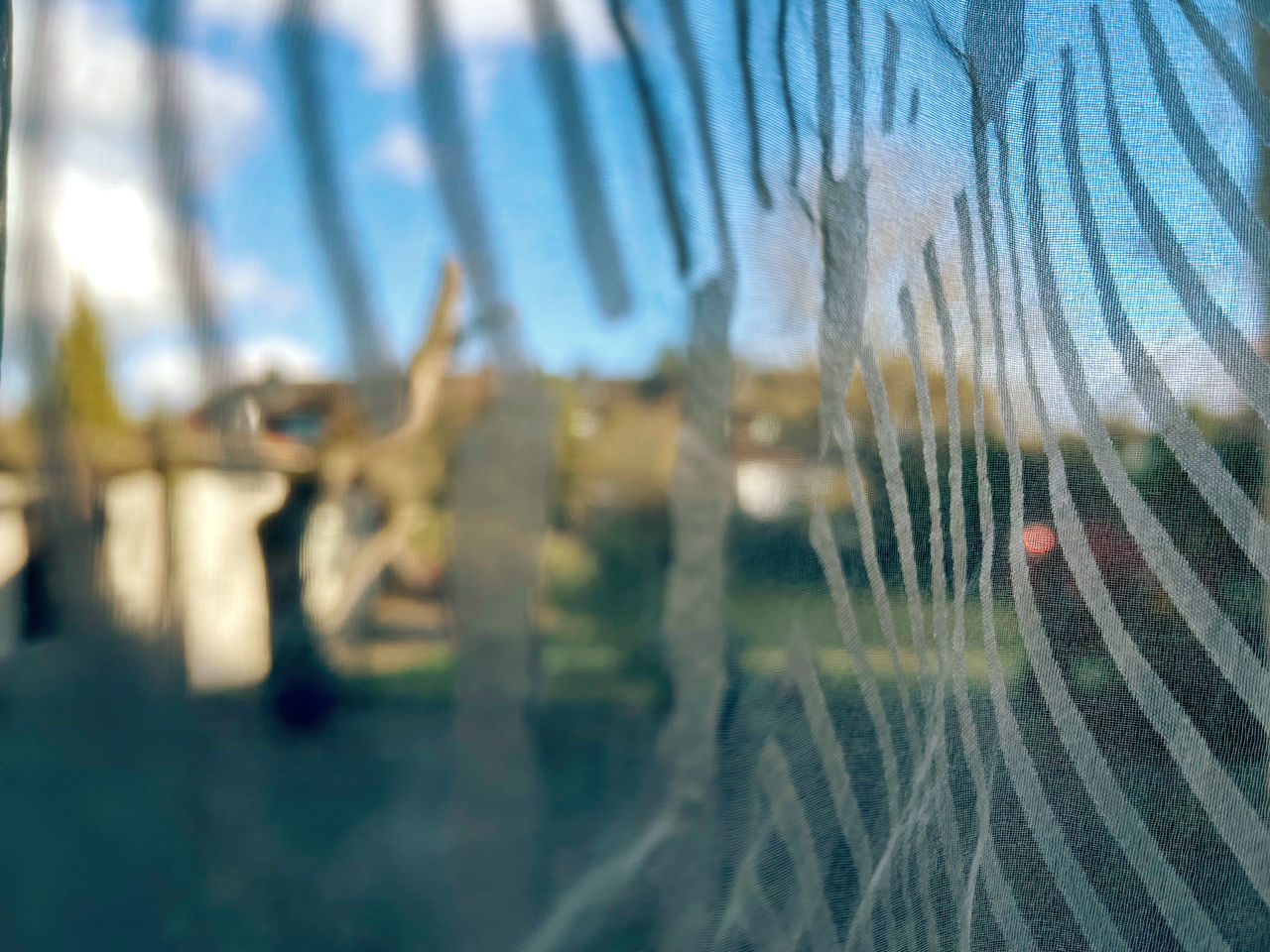 CLOSE-UP OF GLASS WINDOW