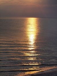 Scenic view of sea against sky at sunset