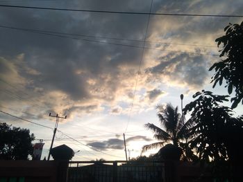 Low angle view of silhouette trees against sky during sunset