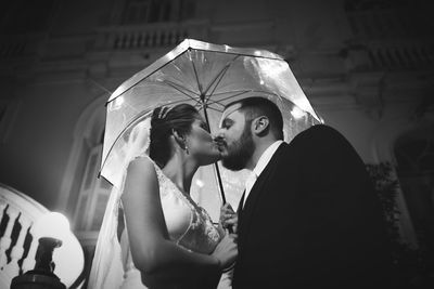 Close-up of couple holding hands