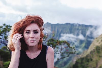 Portrait of woman against mountains