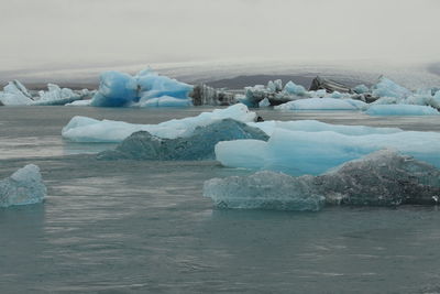 Scenic view of frozen sea against sky