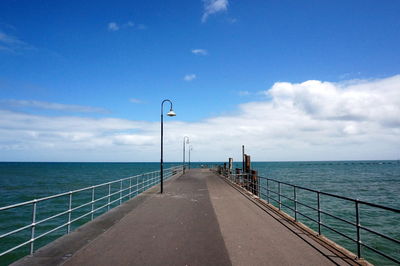 View of beach against cloudy sky