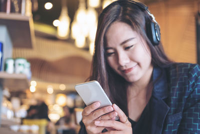 Young woman using mobile phone