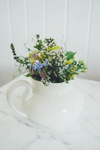 Flower vase on table at home