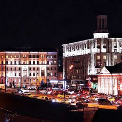 Buildings in city at night