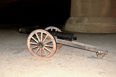 Old rusty bicycle wheel at night