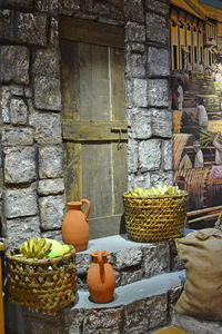 Close-up of fruits in basket against wall