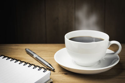 Close-up of coffee cup on table