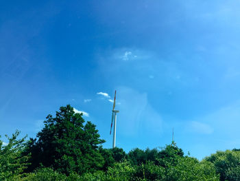 Low angle view of windmill against sky