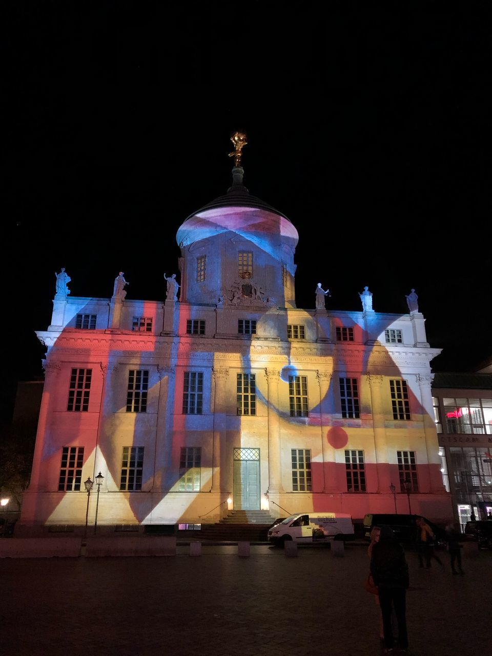 BUILDING AGAINST SKY AT NIGHT