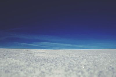 Surface level of landscape against blue sky
