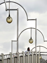 Low angle view of street light against sky