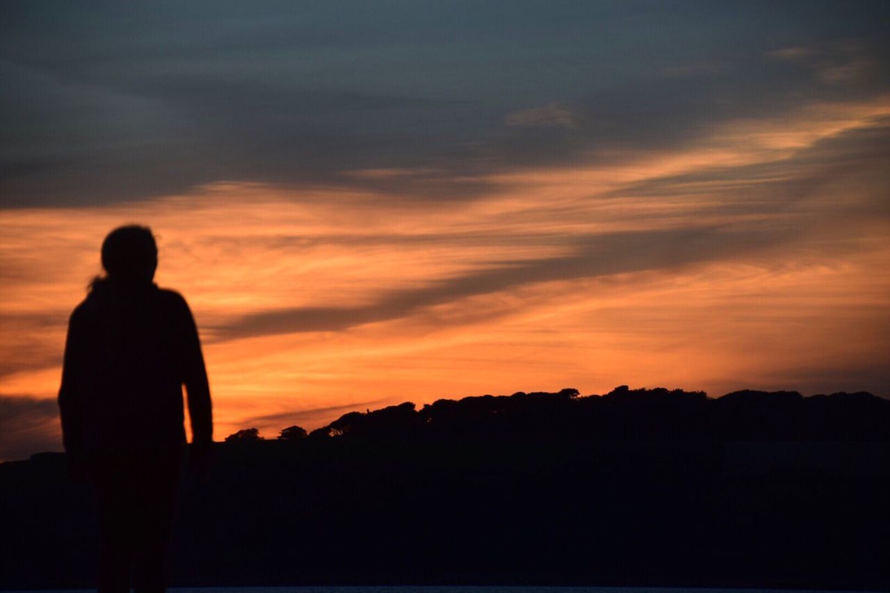 sky, silhouette, sunset, one person, horizon, cloud, beauty in nature, nature, orange color, water, scenics - nature, standing, rear view, tranquility, men, tranquil scene, sea, leisure activity, adult, lifestyles, dusk, full length, evening, land, outdoors, vacation, person, afterglow, sunlight, trip, idyllic, beach, backlighting, solitude, holiday, three quarter length