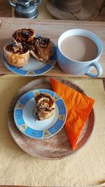 High angle view of food on table. puff pastry roses with apples. the cake is with dried fruit. 