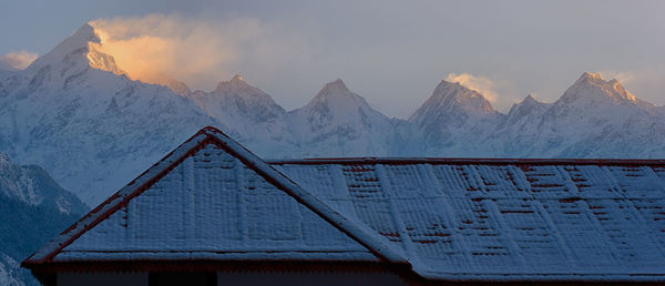 Scenic view of snowcapped mountains against sky